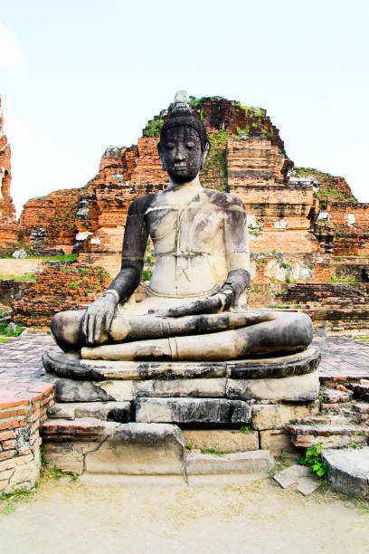 Buddha statue and archaeological site., Ayutthaya ruins., UNESCO world heritage. Ancient archaeological site at Ayutthaya Historical Park, Archaeological sites of Thailand in Ayutthaya, ancient and beautiful. Ayutthaya Province, Thailand. estatua de buda y sitio arqueológico., ruinas de ayutthaya., patrimonio de la humanidad por la unesco. antiguo sitio arqueológico en el parque histórico de ayutthaya, sitios arqueológicos de tailandia en ayutthaya, antiguo y hermoso. provincia de ayutt