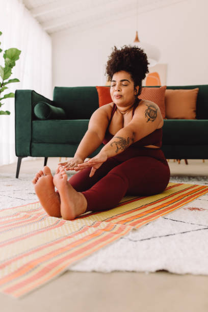 istock Fitness female doing yoga training at home 1323657657
