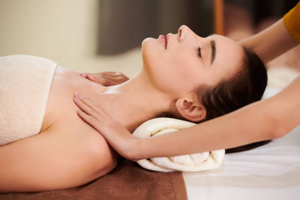 istock Therapist massaging woman 1323657983