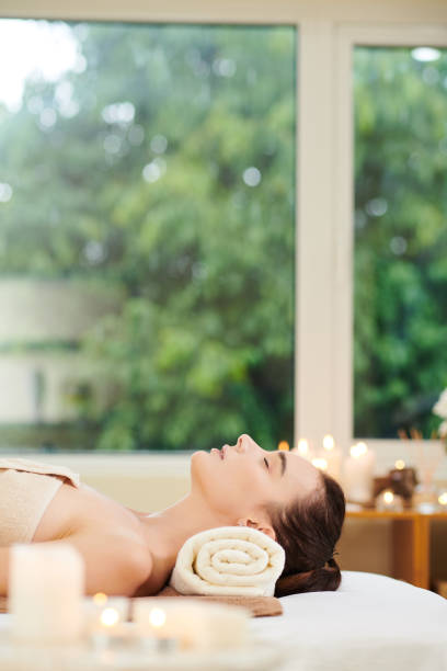 istock Woman lying in spa salon 1323657991