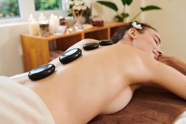 istock Woman relaxing during stone therapy in salon 1323658039