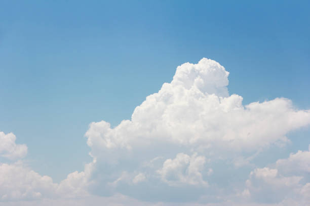 istock white fluffy clouds against the blue sky 1323661845