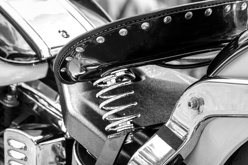 Exceptional suspension and seat of the motorcycle. Black and white image