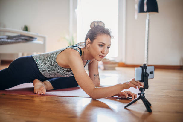 istock Female vlogging about yoga 1323662225