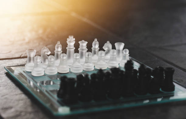 istock Business strategy brainstorm chess board game with hand touch black background with free copy space for your text 1323662376