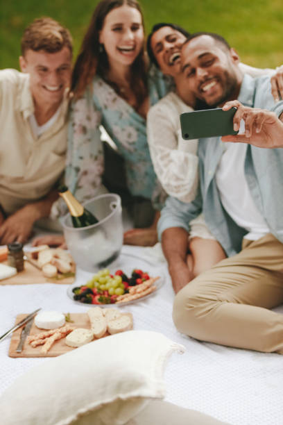 istock Group of friends having fun together and taking selfie 1323662732