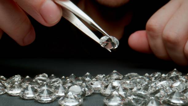 istock CLOSE UP: Jeweler looking a diamonds on the work table 1323664289
