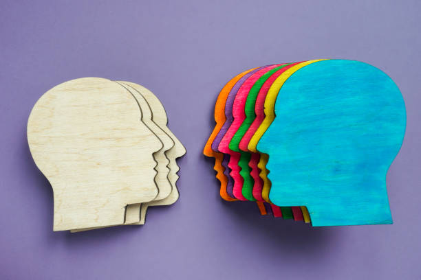 istock Equality and diversity concept. Multi-colored figurines of heads. 1323667065