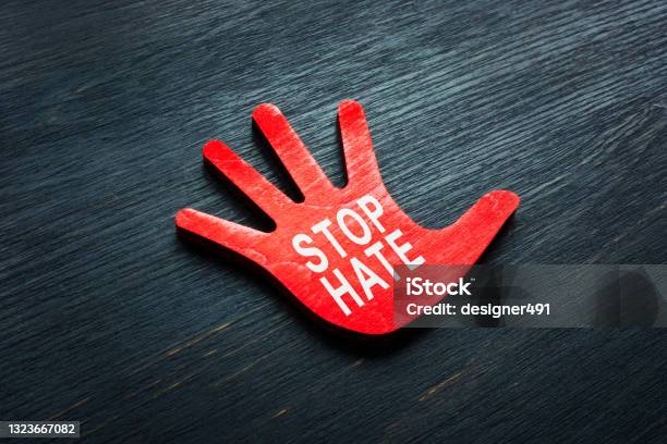 Stop Hate Phrase On The Small Hand Stock Photo - Download Image Now - Hate Crime, Furious, Stop Sign
