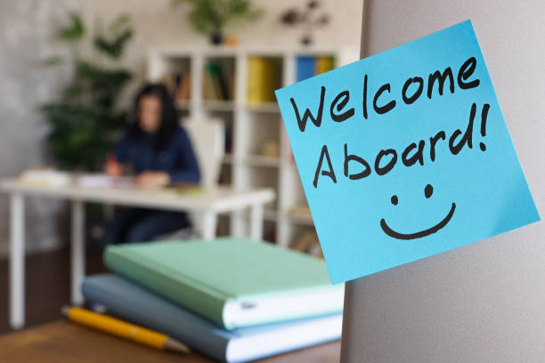 istock Handwritten Welcome aboard and working new employee. 1323667325
