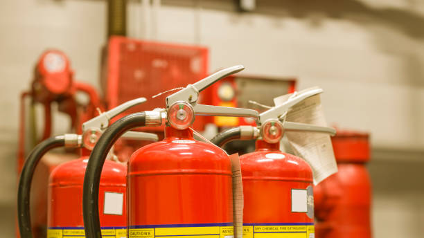 istock The red fire extinguisher is ready for use in case of an indoor fire emergency. 1323672424