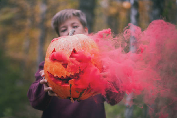 istock Halloween background. Halloween pumpkin jack o lantern decor with scary faces. 1323673052