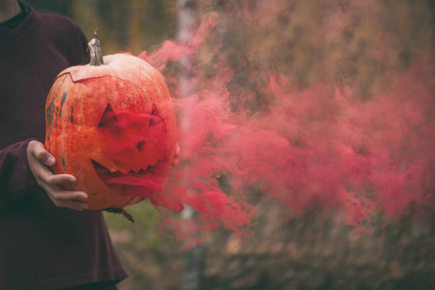 istock Halloween background. Halloween pumpkin jack o lantern decor with scary faces. 1323673176