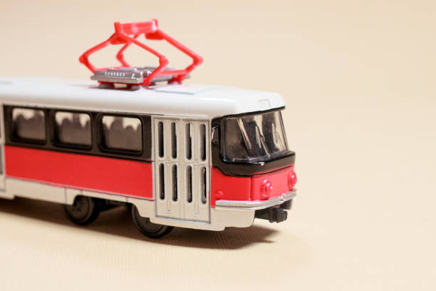 istock Children's toy red white tram on a beige background copy space for text. 1323674338