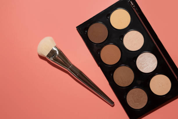 istock contouring set with brush, bronzers and highlighters 1323676769