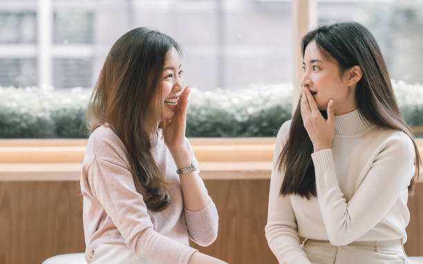 istock Women talking together in coffee shop 1323677986