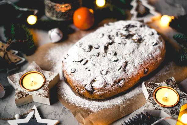 istock Traditional german stollen cake with Christmas decorations. 1323678328