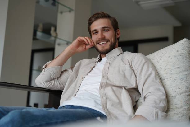 istock Middle-aged man having a restful moment relaxing in sofa. 1323679010
