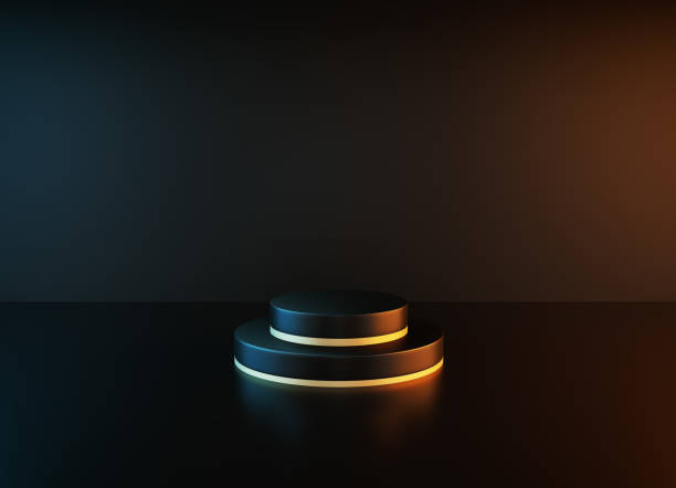 istock Black Podium Illuminated By Spotlights Before Black Background 1323679837