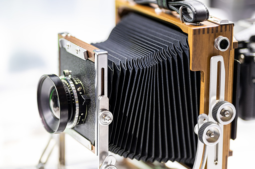 Retro film photo camera isolated on white background.