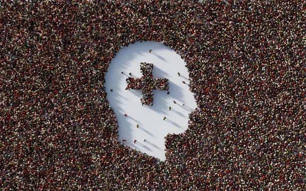 Human crowd forming plus sign inside of a human head shape on white background. Horizontal  composition with copy space. Clipping path is included.
