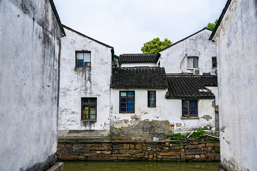 White walls and black tiles of a family in Suzhou, Jiangsu Province, China .White wall and Black tile, Shantang street, Suzhou, Jiangsu Province, China. Small bridges and flowing houses in South China
