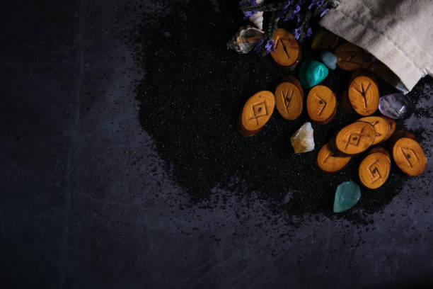 istock homemade wooden runes on a dark background 1323682059