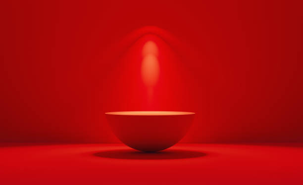 istock Red Podium Illuminated By Spotlights Before Red Background 1323683224