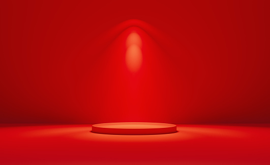 Red podium illuminated by spotlights before red background, Horizontal composition with copy space.