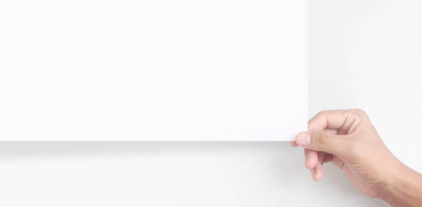 istock Empty space for text.Hand is holding the white blank paper 1323686977