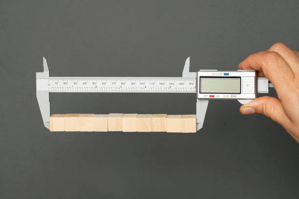 istock Caliper measures 10 wooden cubes 1323687273