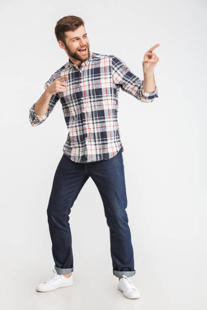 istock Portrait of a cheerful man pointing 1323689090