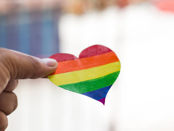 istock Rainbow color heart on hand for lgbtq community. 1323690043