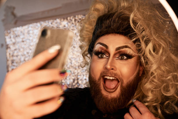 istock Shot of a young man using a cellphone in a studio 1323690263