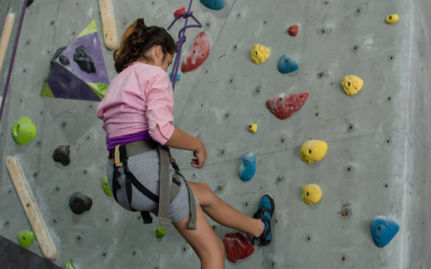 istock A girl climbing rock mountain 1323691488