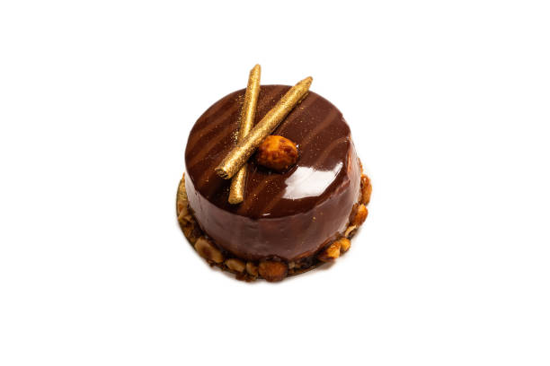 istock Chocolate and caramel cake isolated on a white background. 1323692220