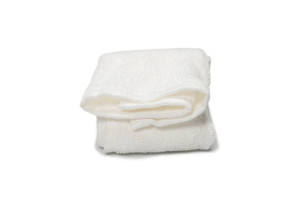 istock White fluffy cotton towel isolated on a white background. 1323692288