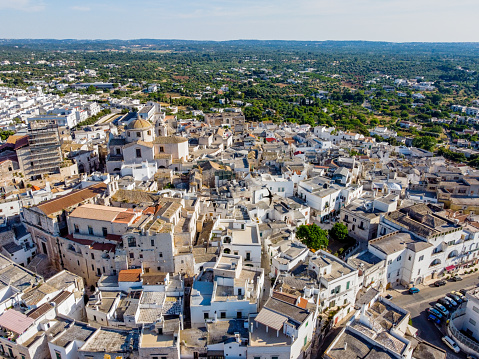 aerial view of the town of Ceglie Messapica, in the south of Italy on Blurred background