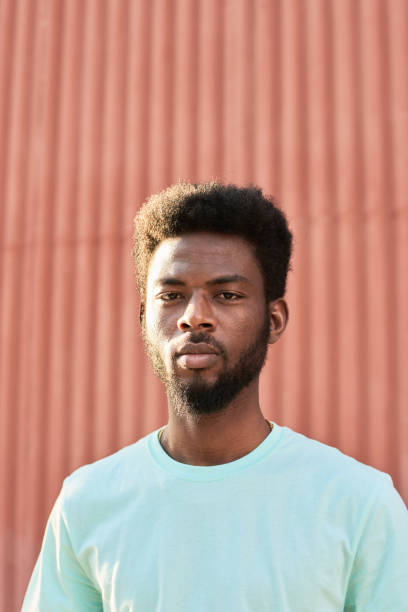 istock African guy standing outdoors 1323694488