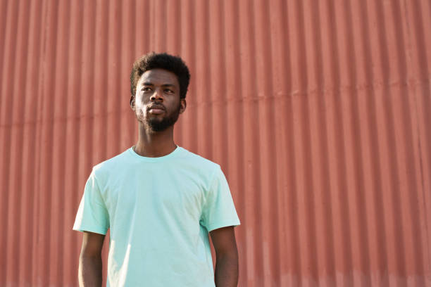 istock African man standing in the city 1323694525