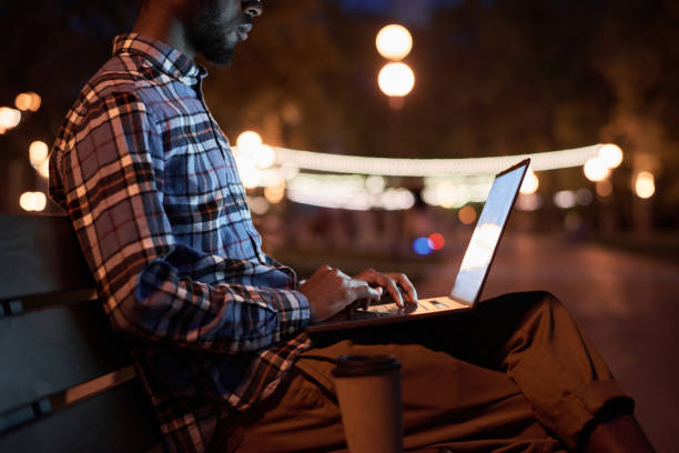 istock Man working in the park in the evening 1323694644