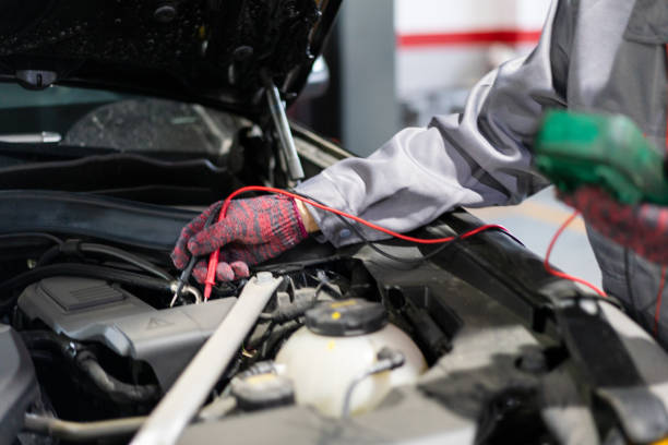 istock Check the car with a car tester, close-up of the engine compartment 1323696335