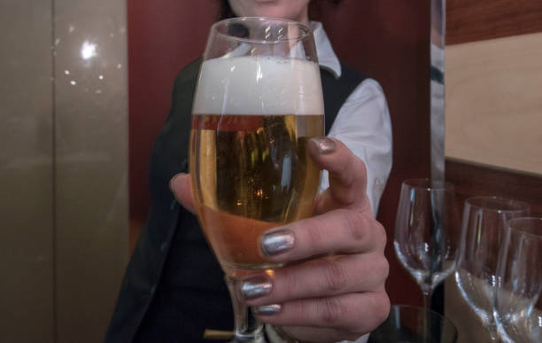 istock serving a beer at a beer bar 1323697431