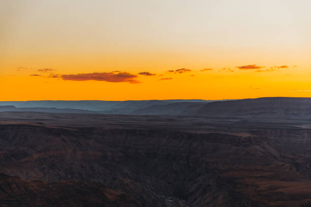 istock Watching the summer sunset above the scenic Fish River Canyon in Namibia 1323698124