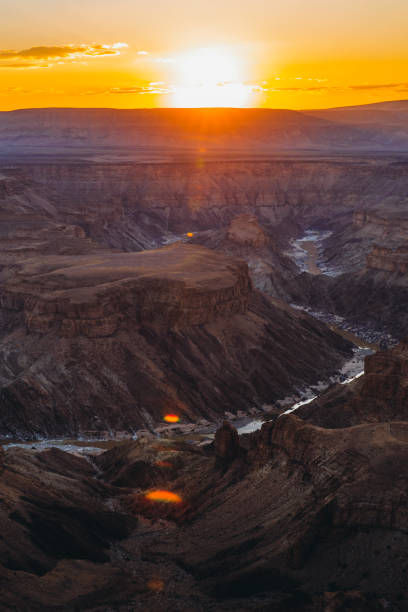 istock Watching the summer sunset above the scenic Fish River Canyon in Namibia 1323698168