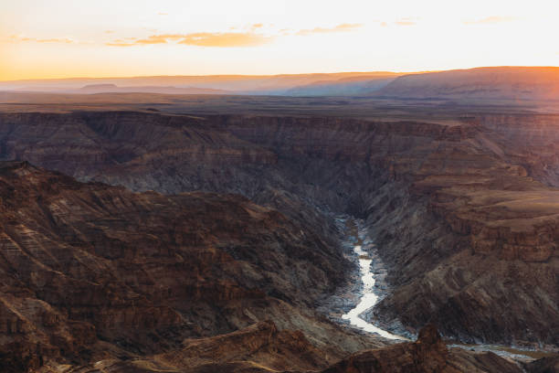 istock Watching the summer sunset above the scenic Fish River Canyon in Namibia 1323698180