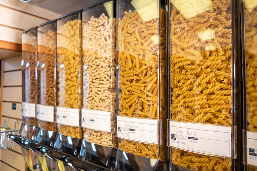 Vegan Spaghetti and pasta in the window of a grocery store or in a supermarket