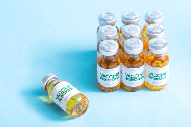 istock Vials with a new modern medicine for coronavirus on a blue background in the laboratory. Copy space for text, SARS-Cov-2 1323702908