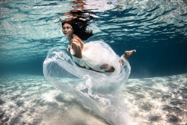 Mature woman underwater.