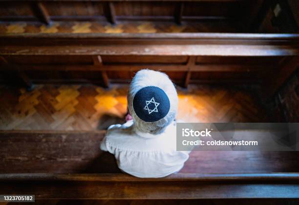 Senior Jewish Man Wearing Skull Cap Praying Inside Synagogue Stock Photo - Download Image Now